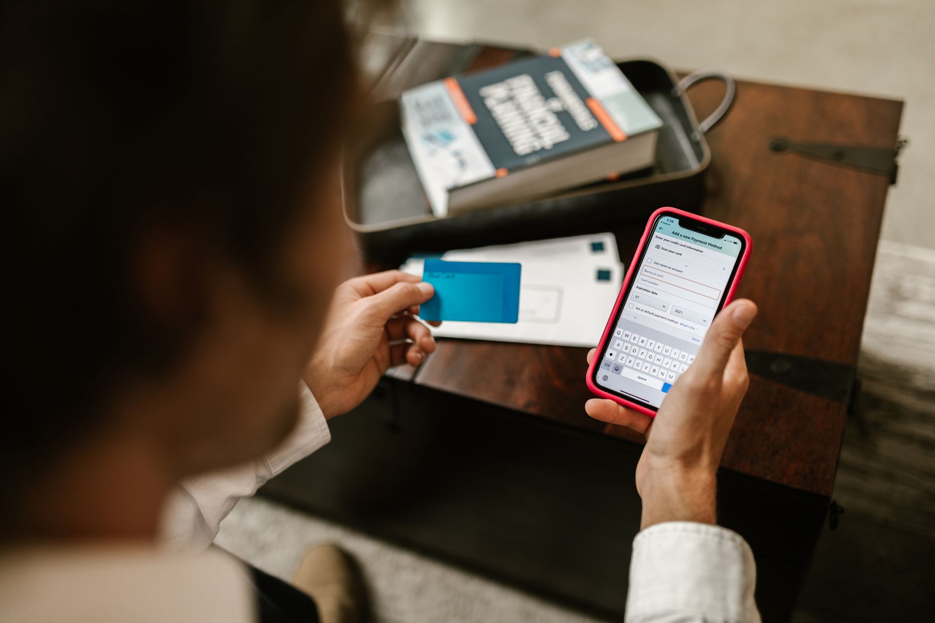 Person checking smartphone bank app and subscription fees