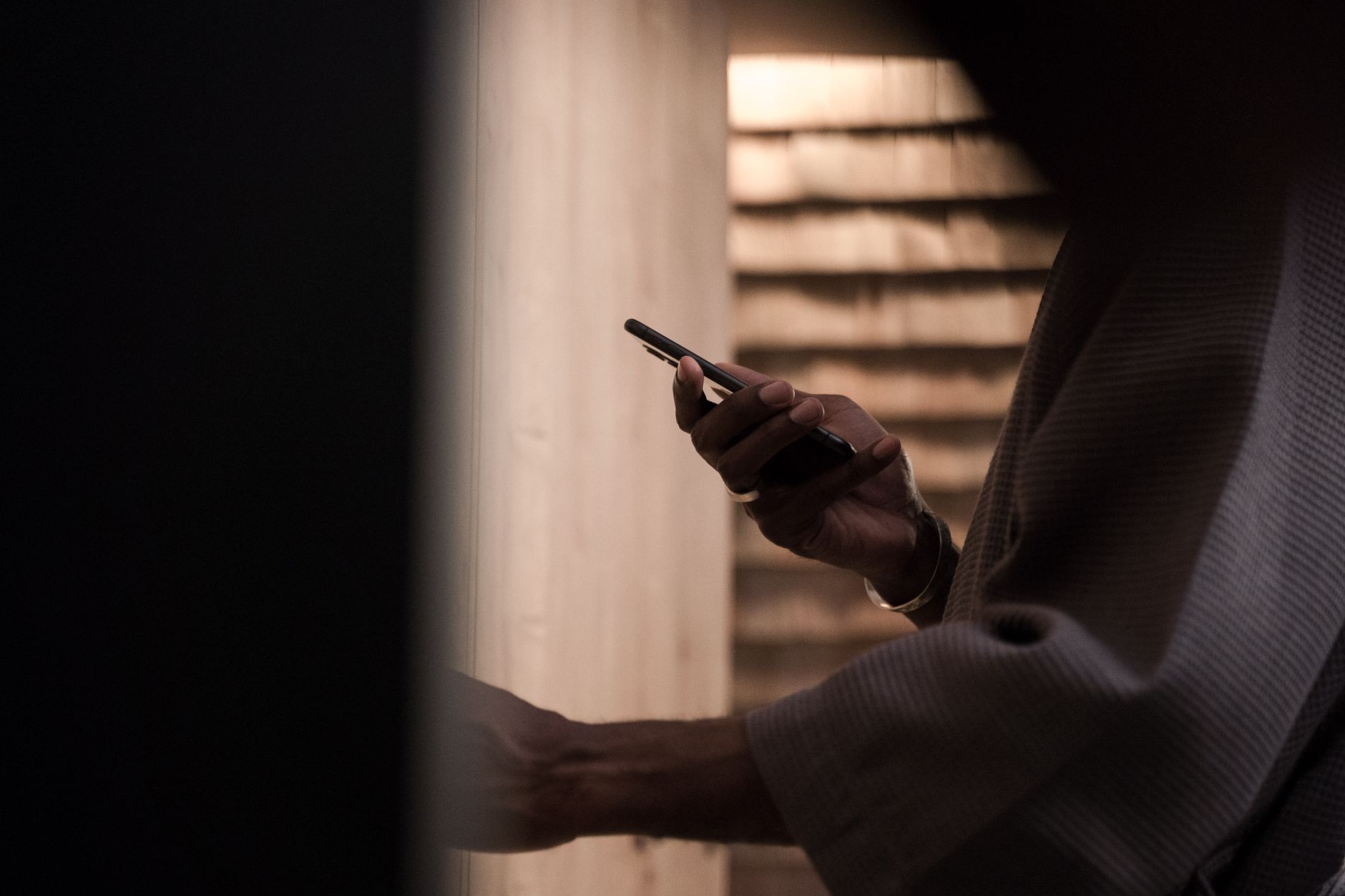 person holding smartphone privacy settings