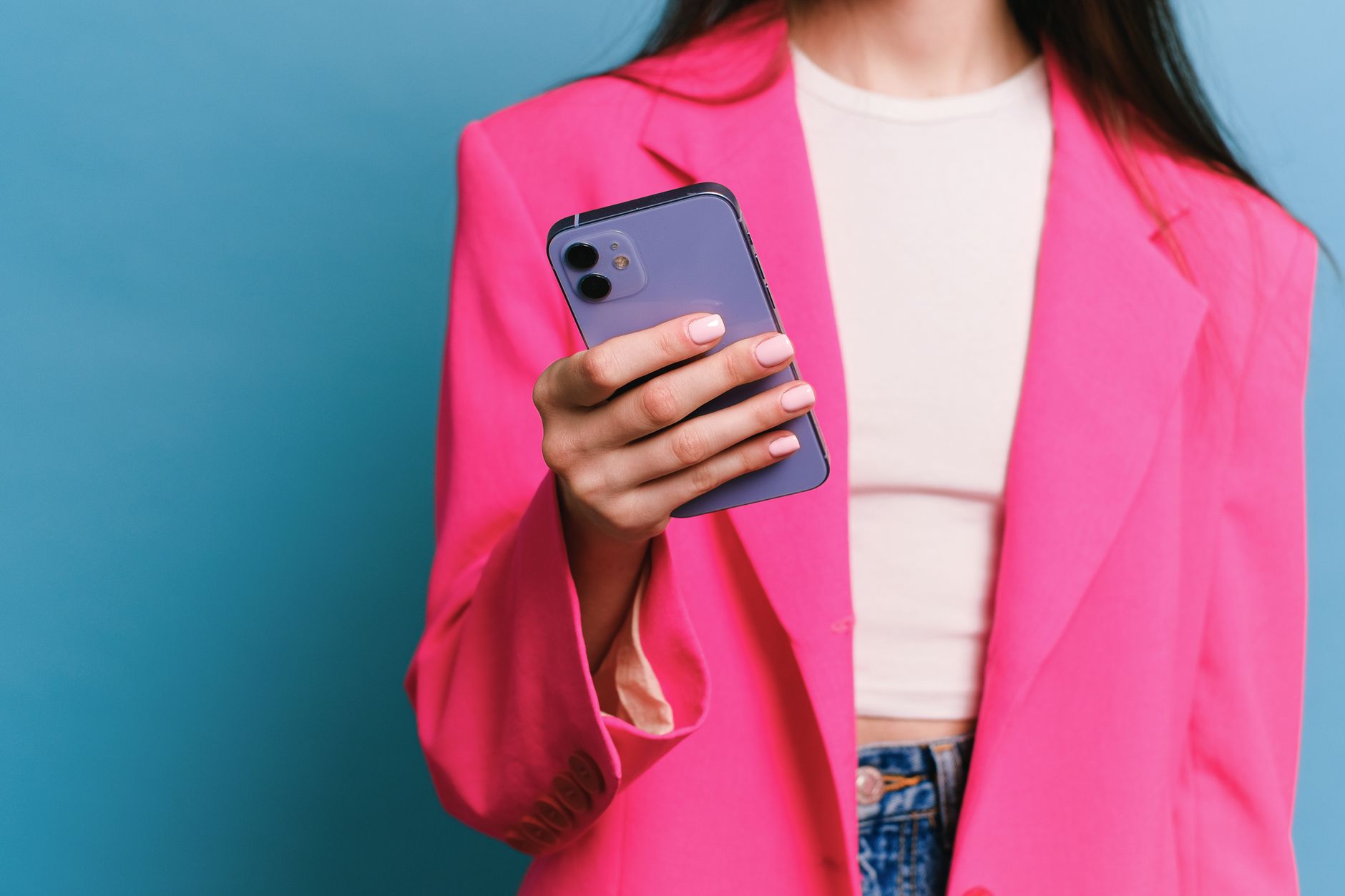 Person looking at iPhone storage alert on screen