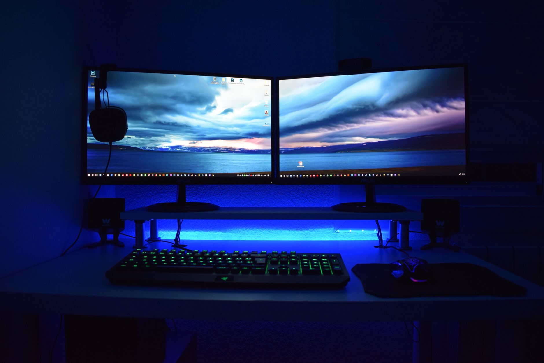 Modern clean desk setup with dual monitors connected to a Windows 11 computer workstation