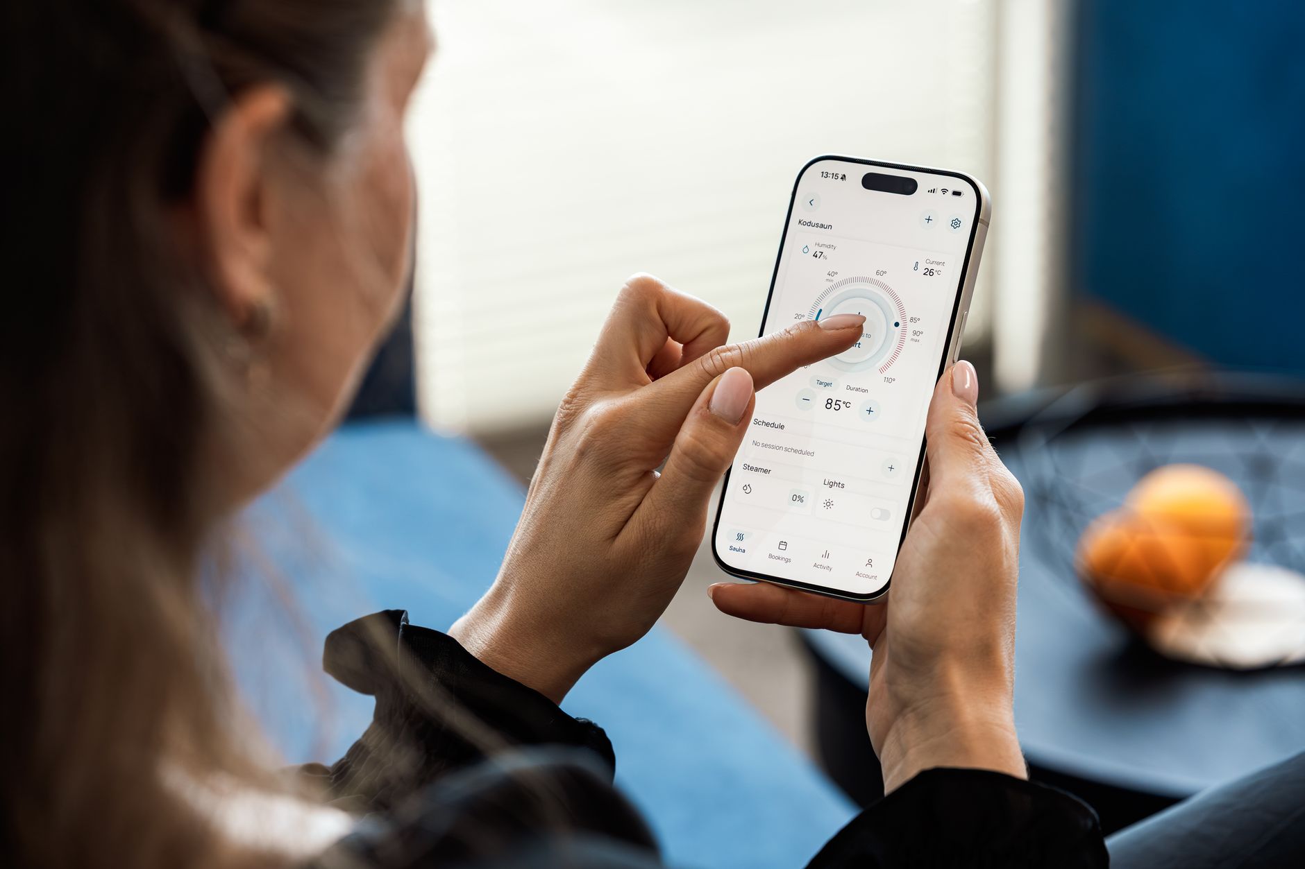 Person holding an iPhone and an Android phone side by side preparing to transfer data