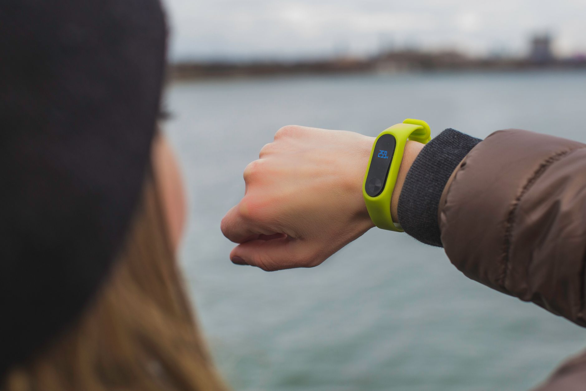 Smartwatch on wrist during a workout at the gym showing fitness metrics