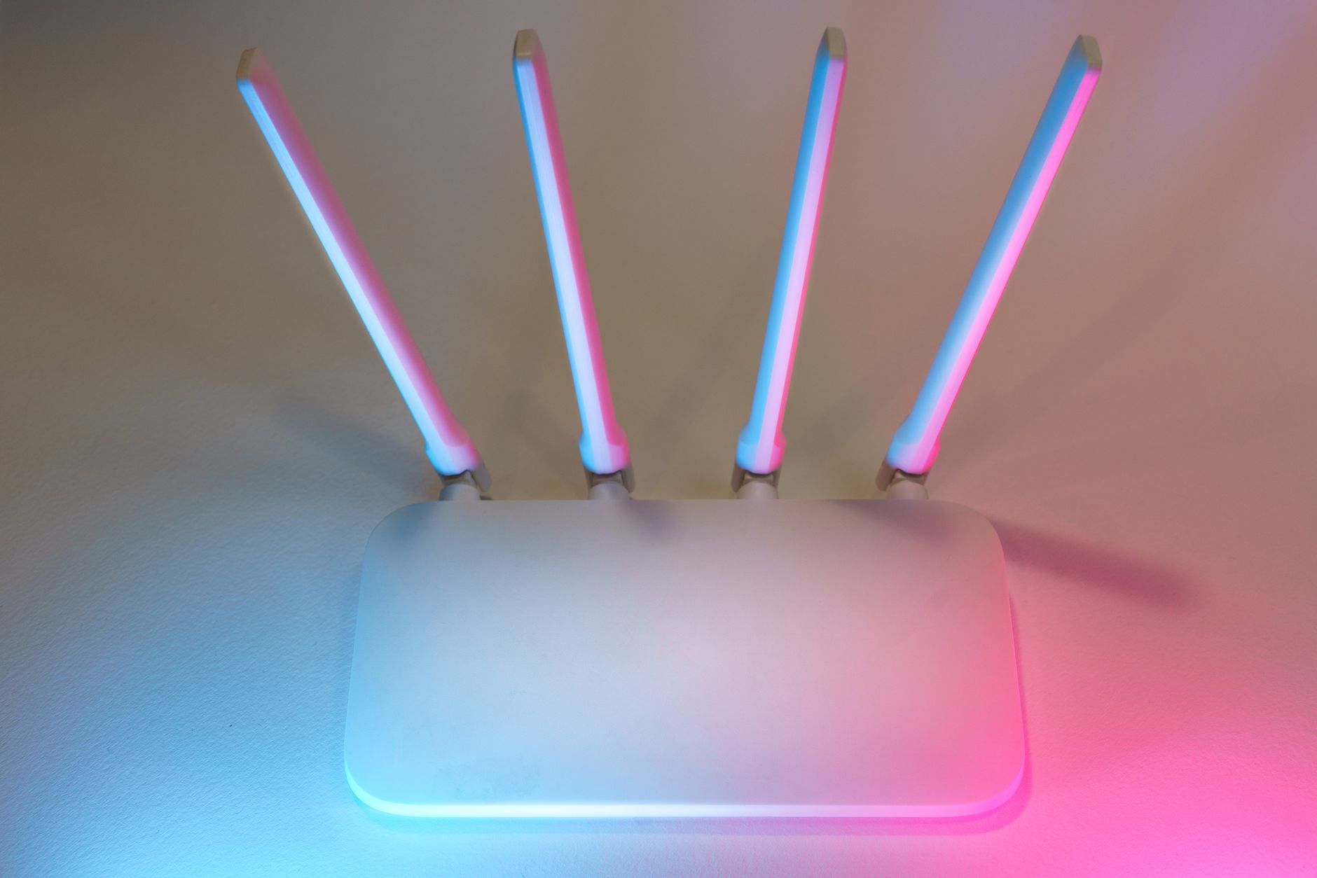 Modern high-speed wireless Wi-Fi 7 router showing multiple glowing band status lights