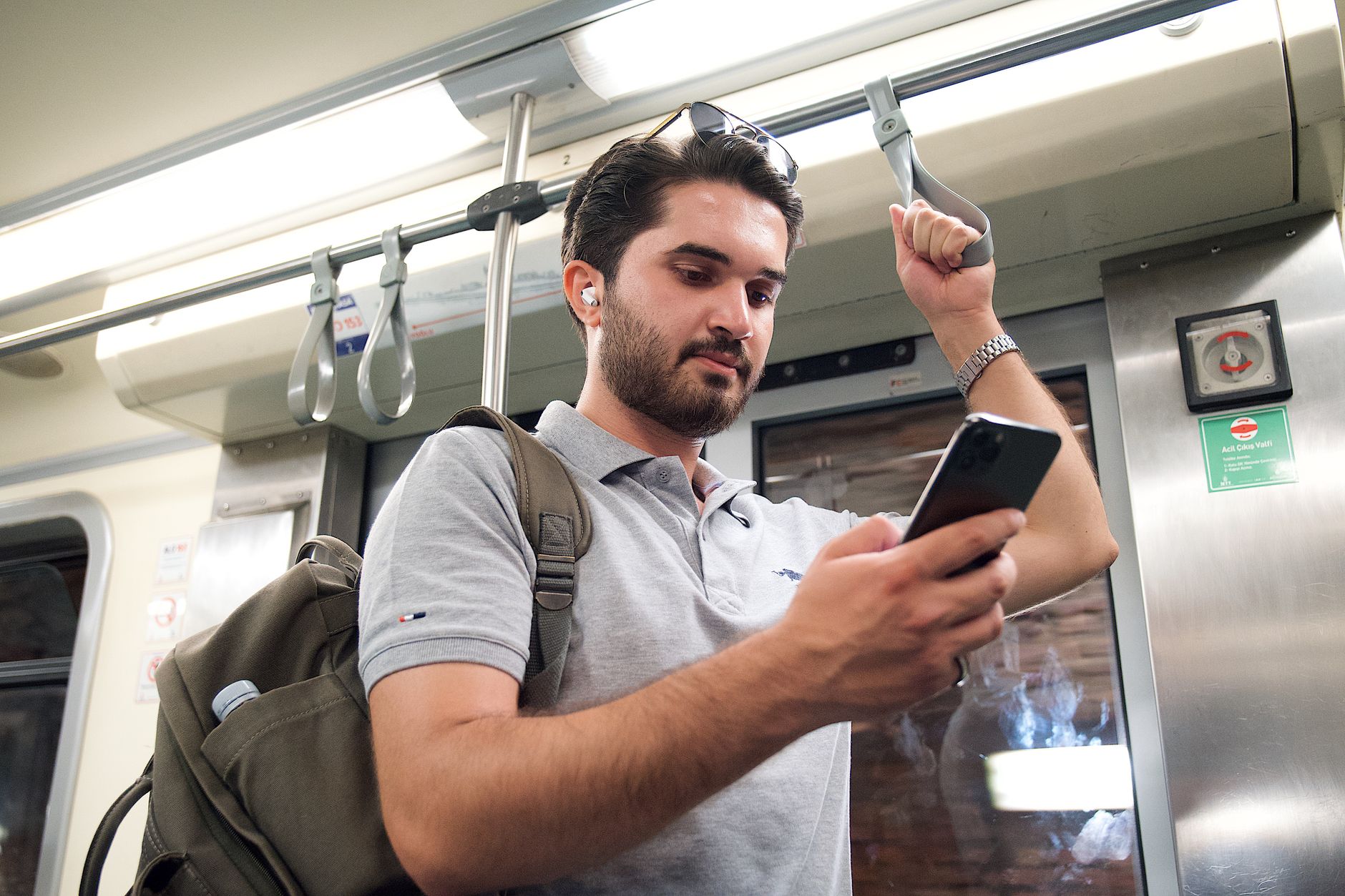 commuter wearing wireless earbuds